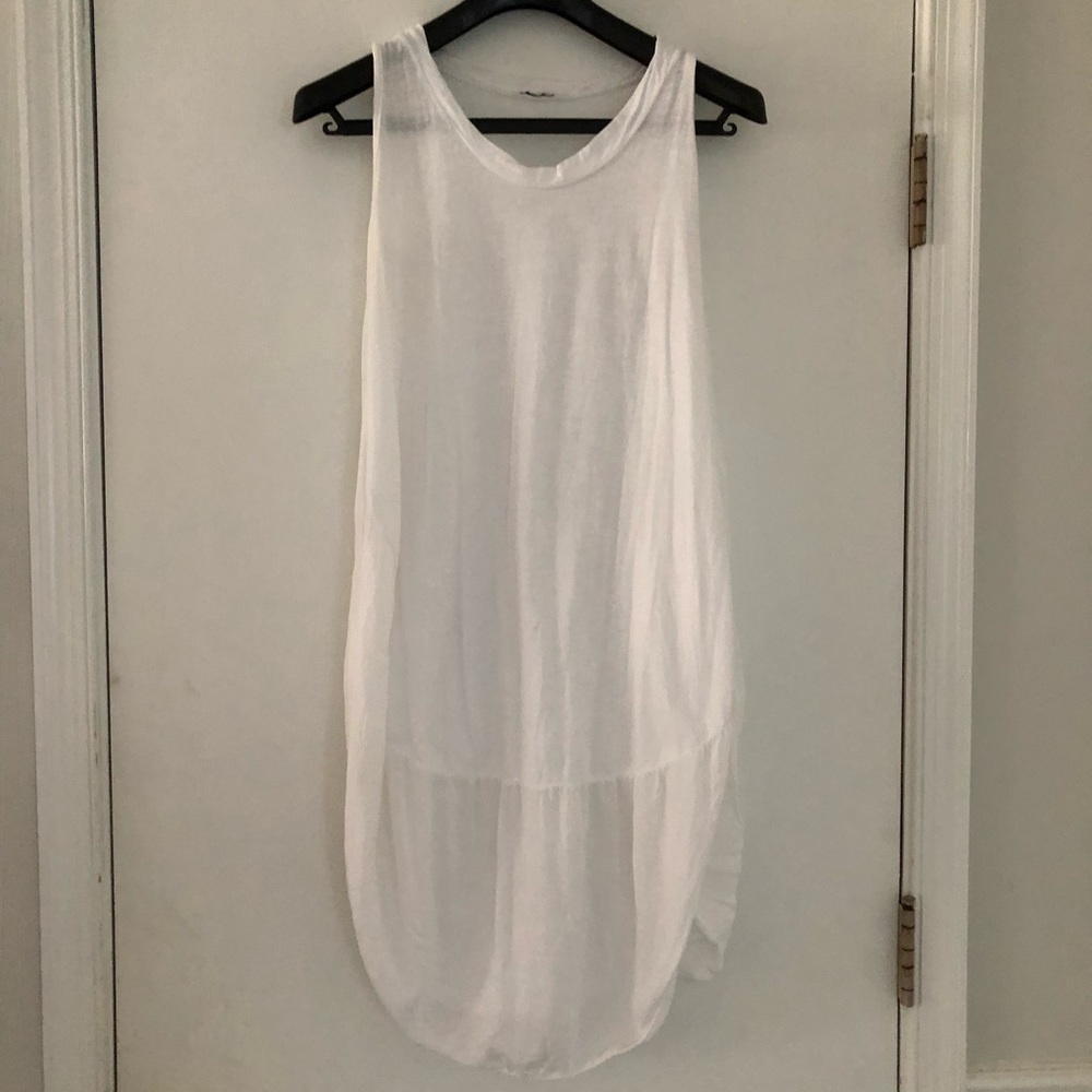 Simple, free-flowing white bell dress